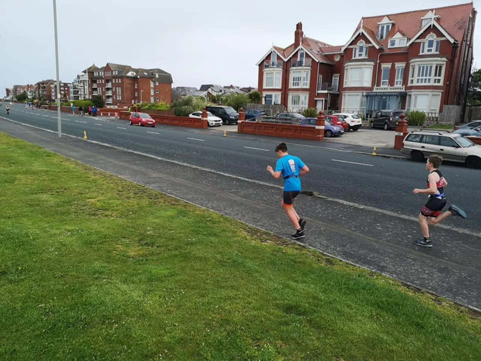 Juniors running along Preston seafront during training
